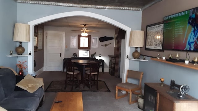 dining area with carpet and ceiling fan