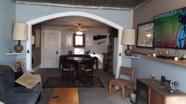 carpeted dining space featuring ceiling fan