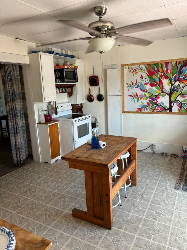 kitchen with ceiling fan and white range with electric stovetop