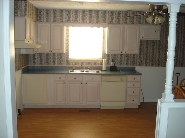 kitchen featuring white cabinetry, light hardwood / wood-style flooring, white dishwasher, and sink