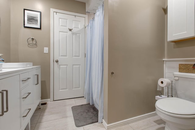 bathroom featuring vanity, toilet, tile patterned flooring, and a shower with shower curtain