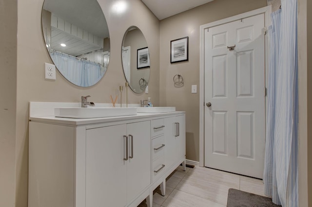 bathroom with vanity and tile patterned flooring