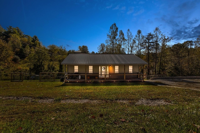 view of front of home featuring a yard and a porch