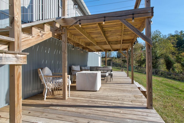 wooden deck featuring a yard