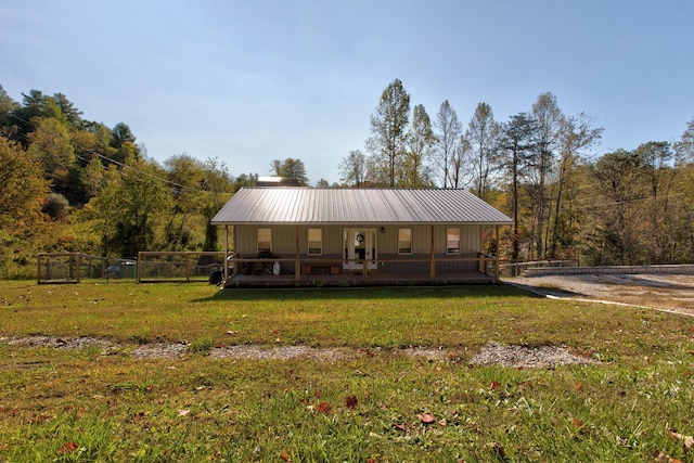 view of front of home with covered porch and a front yard