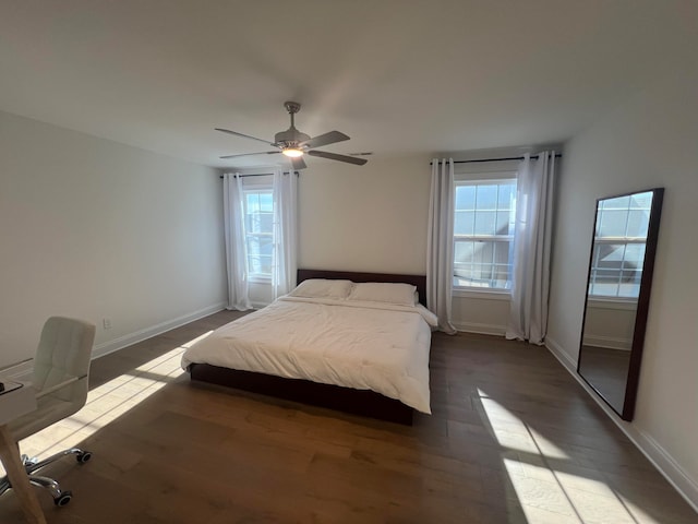 unfurnished bedroom with ceiling fan and wood-type flooring