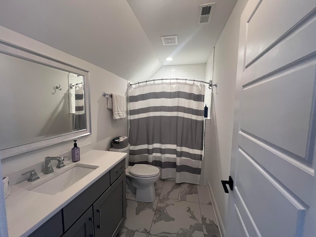 bathroom featuring vanity, toilet, and walk in shower