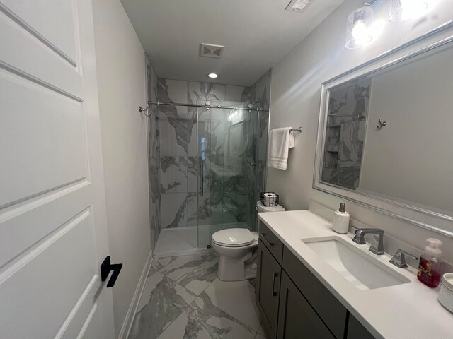 bathroom featuring vanity, toilet, and walk in shower