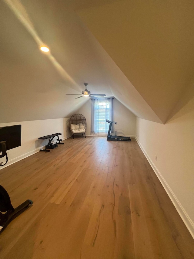 additional living space featuring ceiling fan, hardwood / wood-style floors, and vaulted ceiling