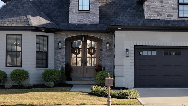 doorway to property with french doors and a garage