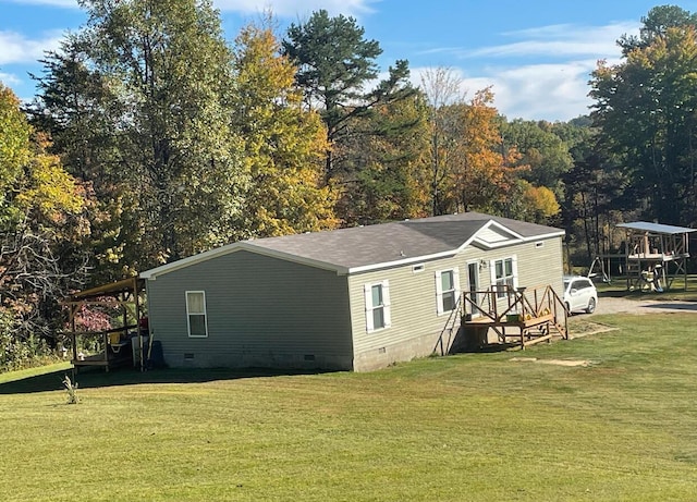 view of side of home featuring a yard