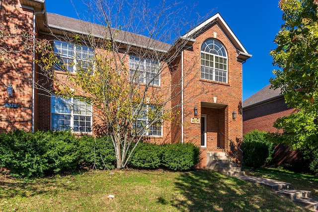 view of front of property with a front lawn