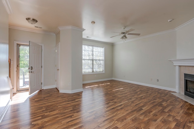 unfurnished living room with ceiling fan, crown molding, dark hardwood / wood-style flooring, and a fireplace