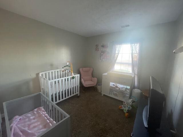 bedroom featuring dark colored carpet