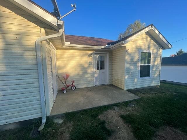 back of property featuring a patio area