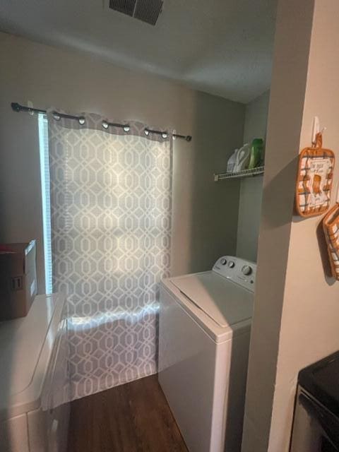 laundry room featuring hardwood / wood-style flooring and washer / clothes dryer