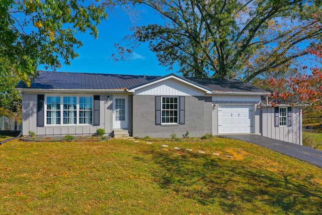 ranch-style home with a front lawn and a garage