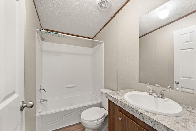 full bathroom featuring toilet, shower / bathtub combination, hardwood / wood-style floors, vanity, and a textured ceiling