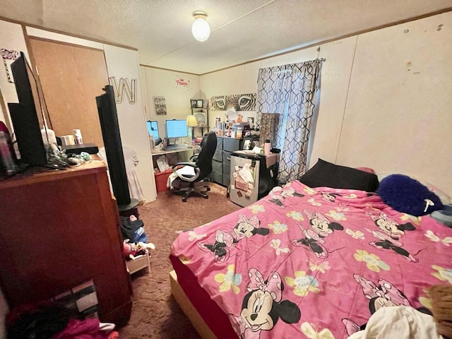 bedroom featuring a textured ceiling and carpet flooring