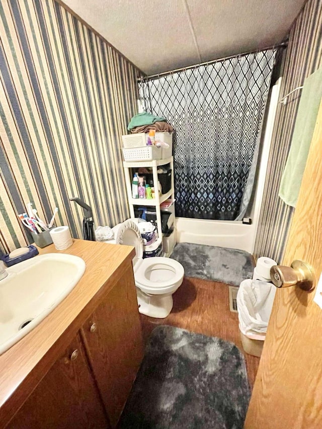 bathroom with vanity, a textured ceiling, toilet, and a shower with shower curtain