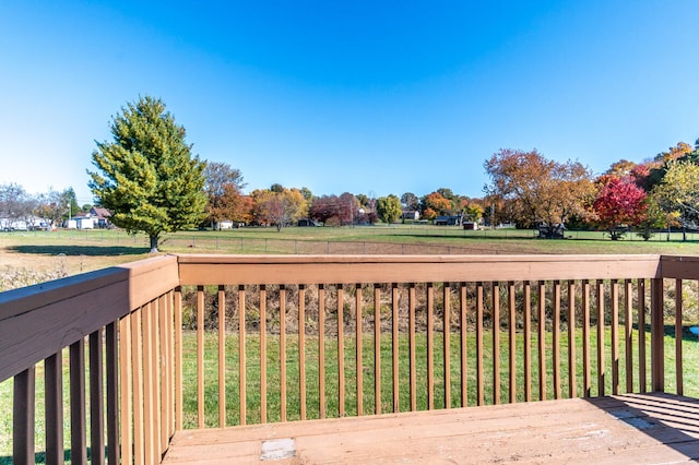 wooden deck featuring a yard