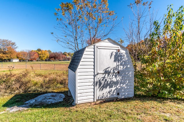 view of outbuilding with a yard