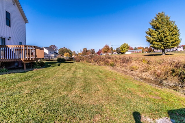 view of yard with a wooden deck