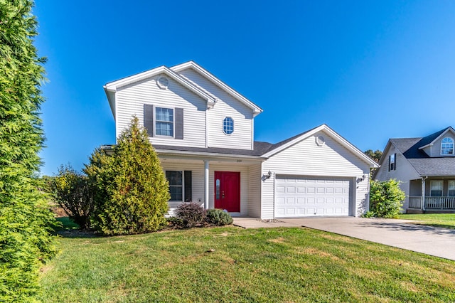 front of property with a front yard and a garage