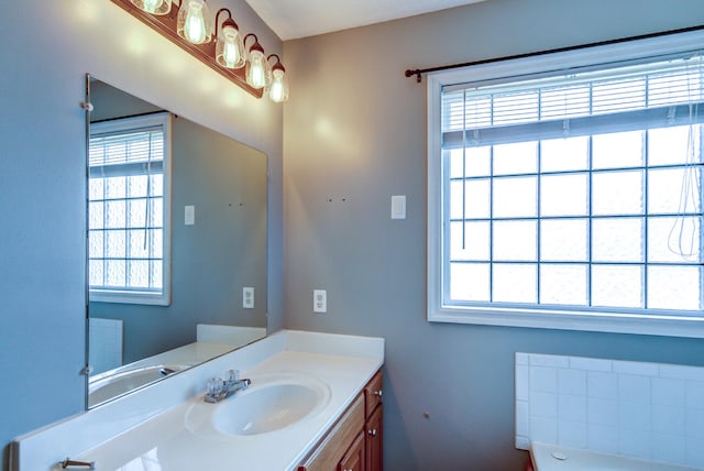 bathroom featuring vanity and plenty of natural light