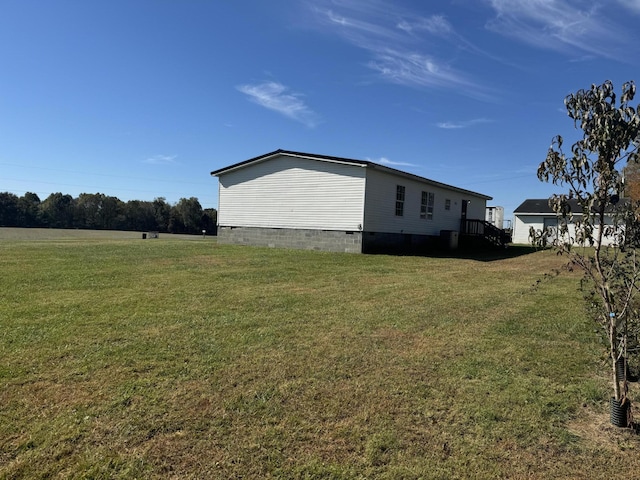 view of home's exterior with a yard