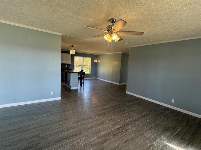 unfurnished living room featuring crown molding, a textured ceiling, dark wood-type flooring, and ceiling fan