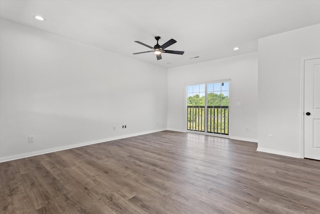 empty room featuring dark hardwood / wood-style floors and ceiling fan