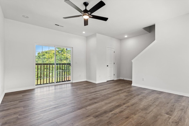 unfurnished living room featuring ceiling fan and hardwood / wood-style flooring