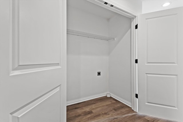 washroom with dark wood-type flooring and hookup for an electric dryer