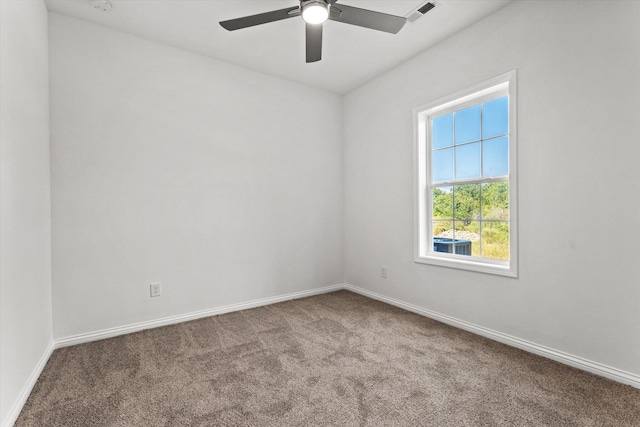 spare room with carpet and ceiling fan