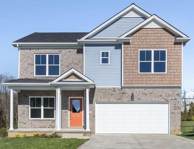 view of front of property featuring driveway, brick siding, and an attached garage