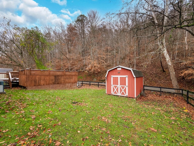 ranch-style house with a storage unit, a patio area, and a front yard