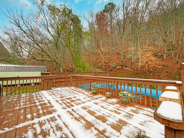 view of yard featuring a shed and a wooden deck