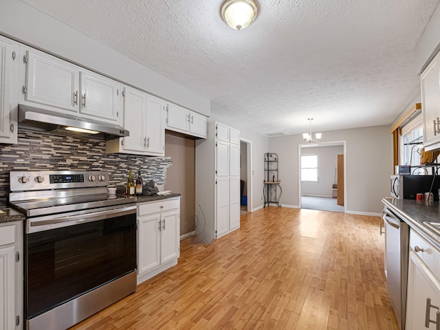 kitchen with white cabinets, sink, a textured ceiling, appliances with stainless steel finishes, and light hardwood / wood-style floors