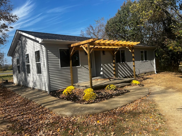 single story home with a pergola