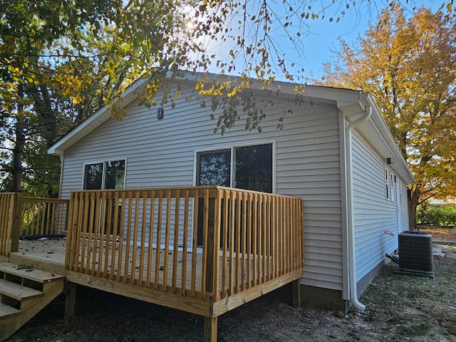 back of property featuring a wooden deck and central AC unit