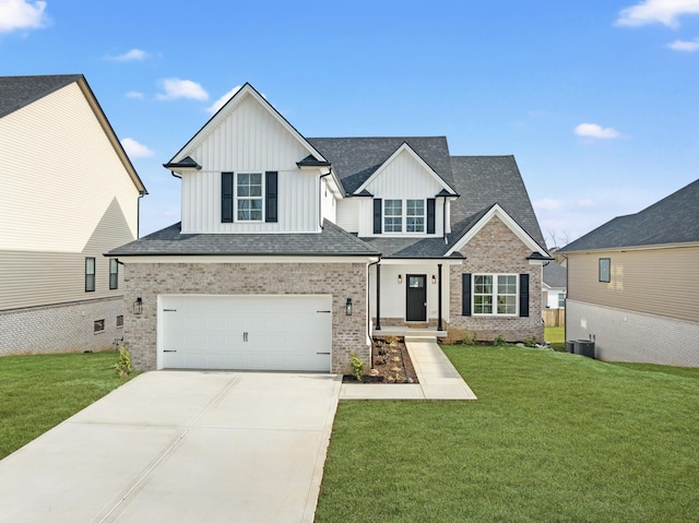 view of front of property with brick siding, board and batten siding, a front yard, a garage, and driveway