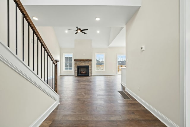 unfurnished living room with dark wood-style floors, baseboards, visible vents, and recessed lighting