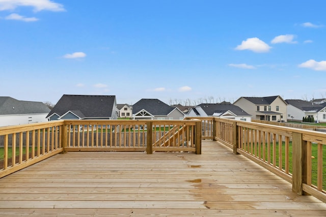 wooden terrace featuring a residential view