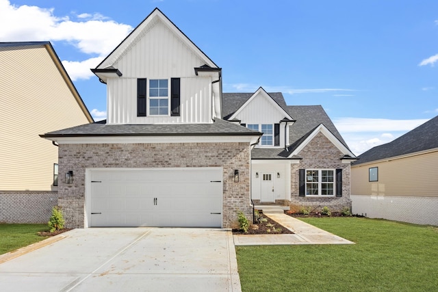 view of front of home with an attached garage, brick siding, concrete driveway, board and batten siding, and a front yard