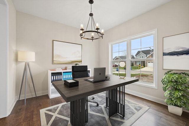 office with baseboards, a chandelier, and wood finished floors