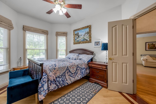 bedroom featuring light wood-type flooring and ceiling fan