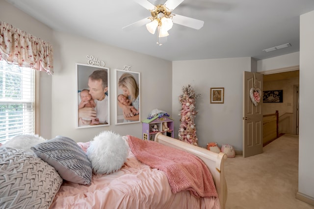 carpeted bedroom featuring ceiling fan