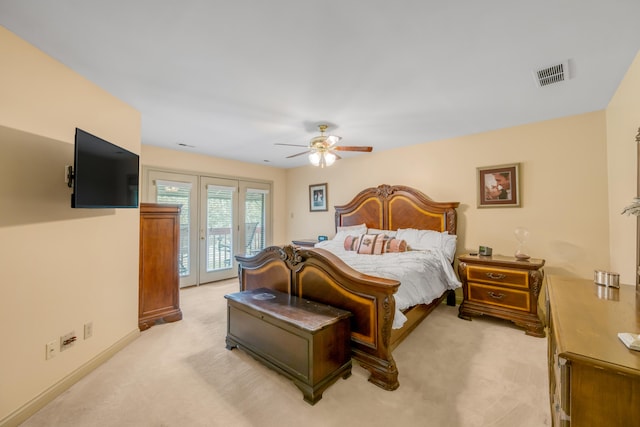 bedroom with french doors, light carpet, access to outside, and ceiling fan