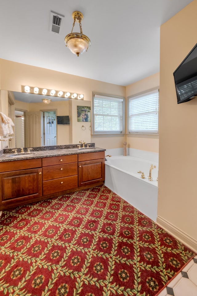 bathroom featuring vanity and a bathtub